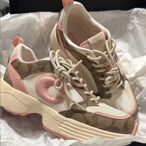 Coach sneakers pink and cream color with classic coach symbol in good condition